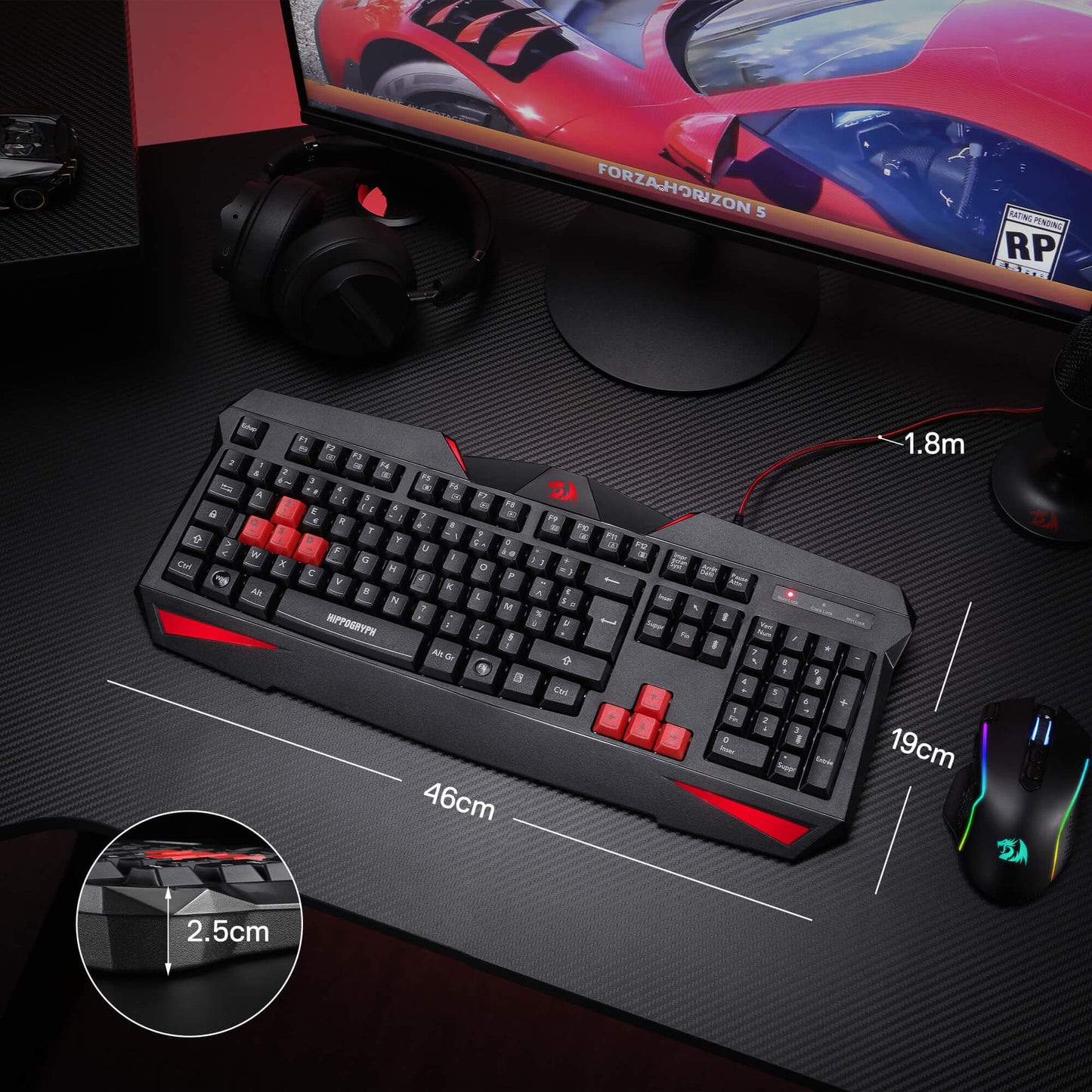 Gaming keyboard with red accents on a desk setup with a monitor, mouse, and headset.