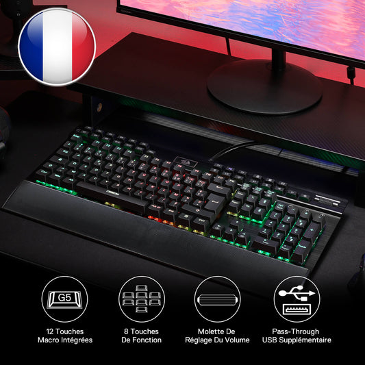 Redragon Gaming keyboard with RGB lighting on a desk setup, featuring a French flag icon.