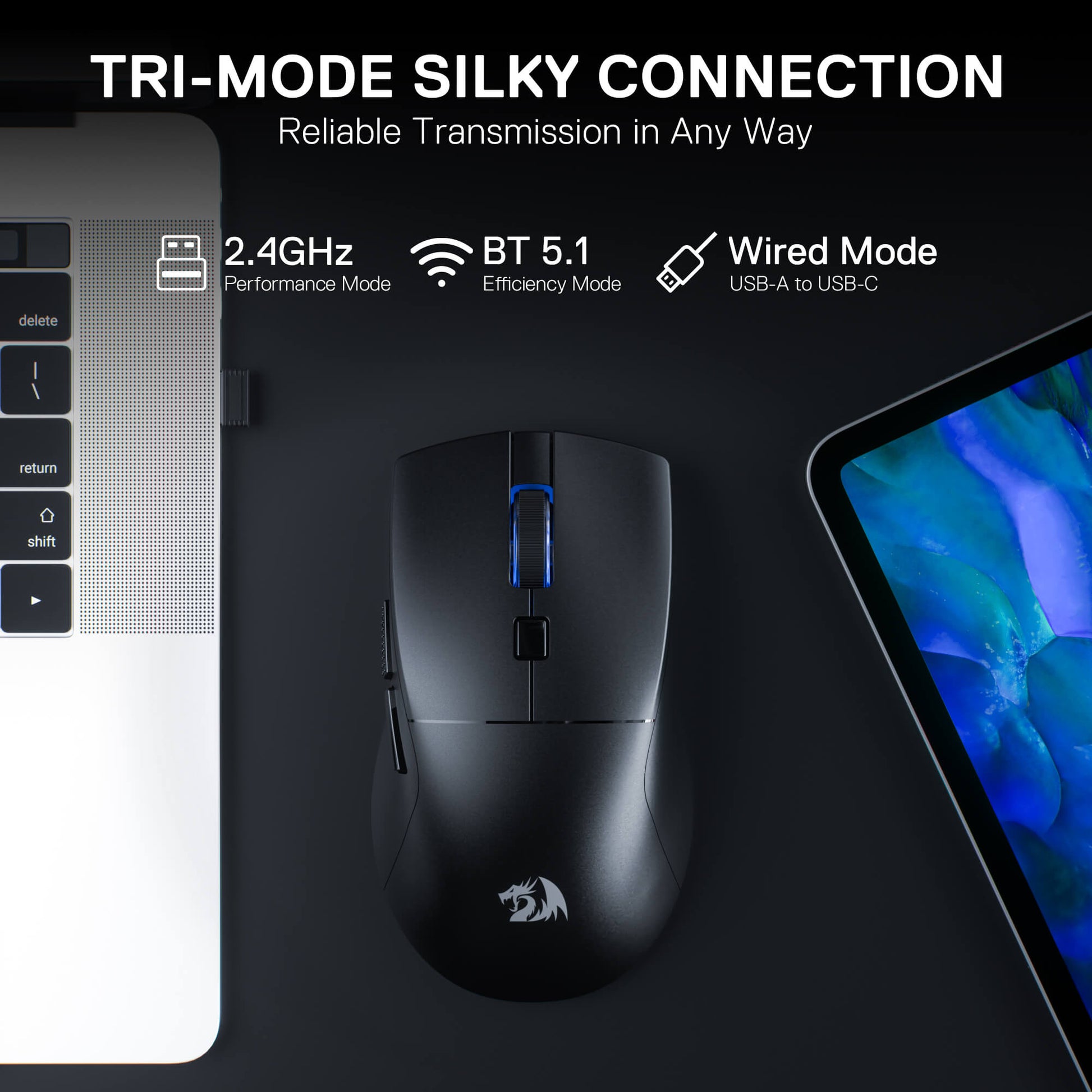 Black gaming mouse with connectivity modes on a laptop and tablet background