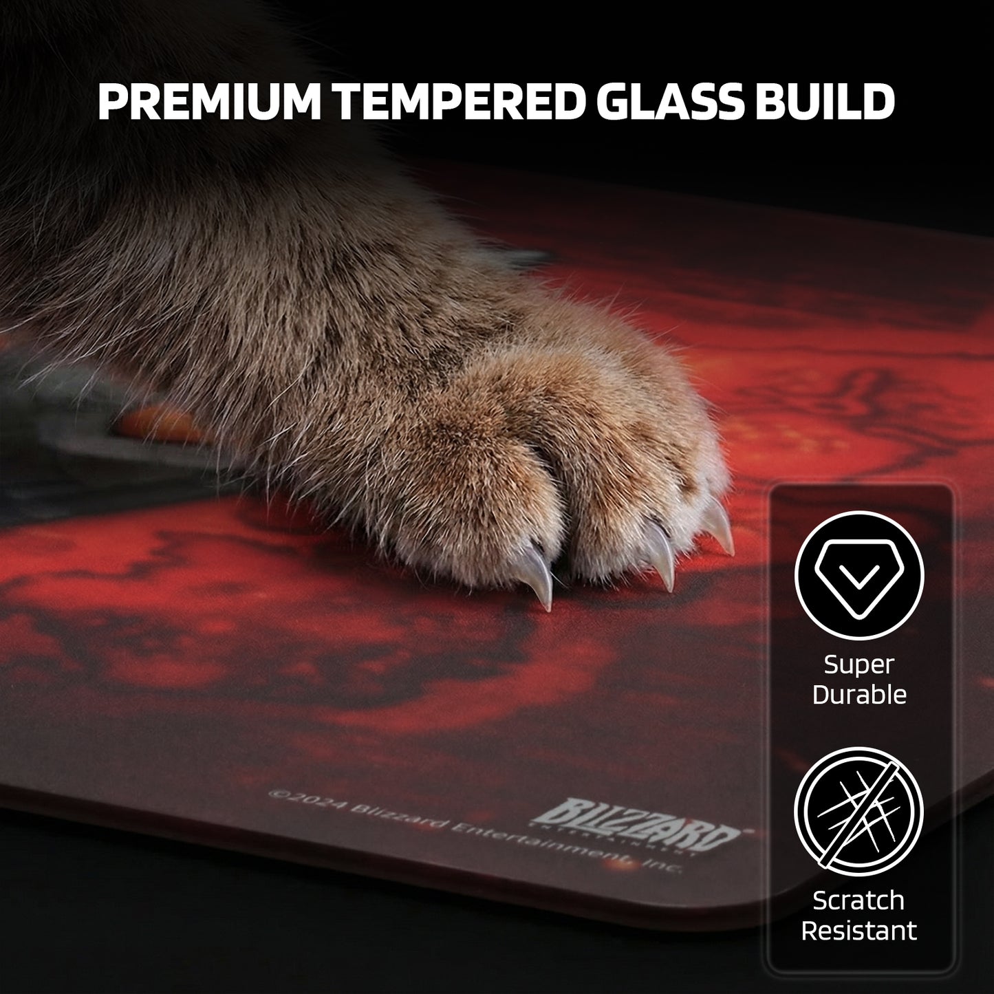 The pad’s "PREMIUM TEMPERED GLASS BUILD" is showcased: it’s super durable and scratch-resistant, even against a cat’s claws.