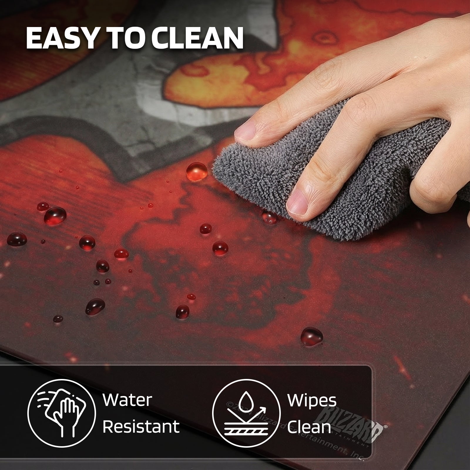 The mouse pad is "EASY TO CLEAN" (water-resistant, wipeable), demonstrated by a hand cleaning water droplets off its surface.