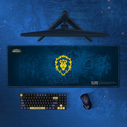 Gaming setup with mouse pad, keyboard, and mouse on a blue surface