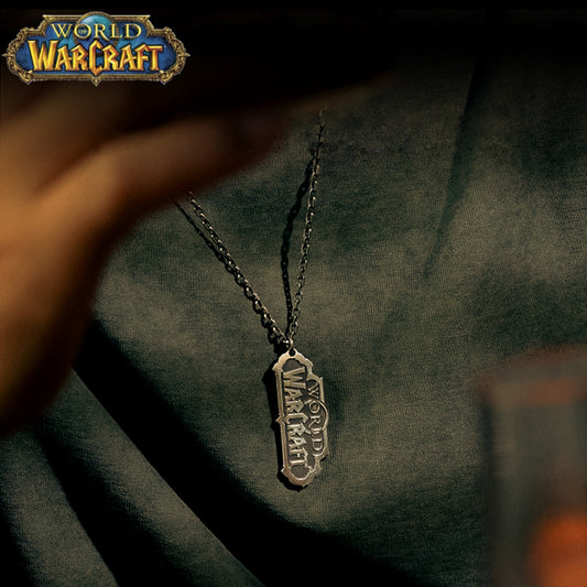 In the top corner sits the colorful "WORLD OF WARCRAFT" logo, while below, a metallic "WORLD OF WARCRAFT" pendant (on a chain) rests against dark fabric.