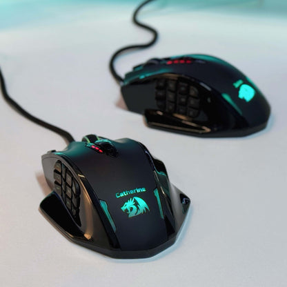 Two Redragon gaming mice with illuminated designs on a light background