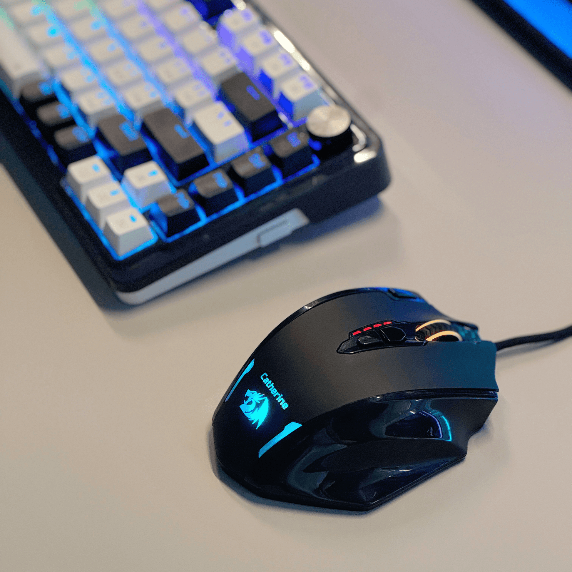 Redragon M908 Gaming mouse and K673 PRO keyboard on a desk