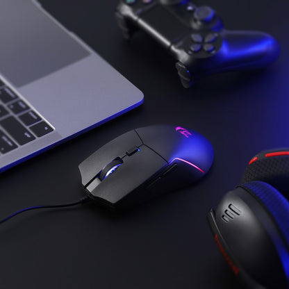 A close-up of the Redragon gaming mouse (with RGB backlighting) is shown on a desk, paired with a laptop, controller, and headset to highlight its fit in a gaming setup.