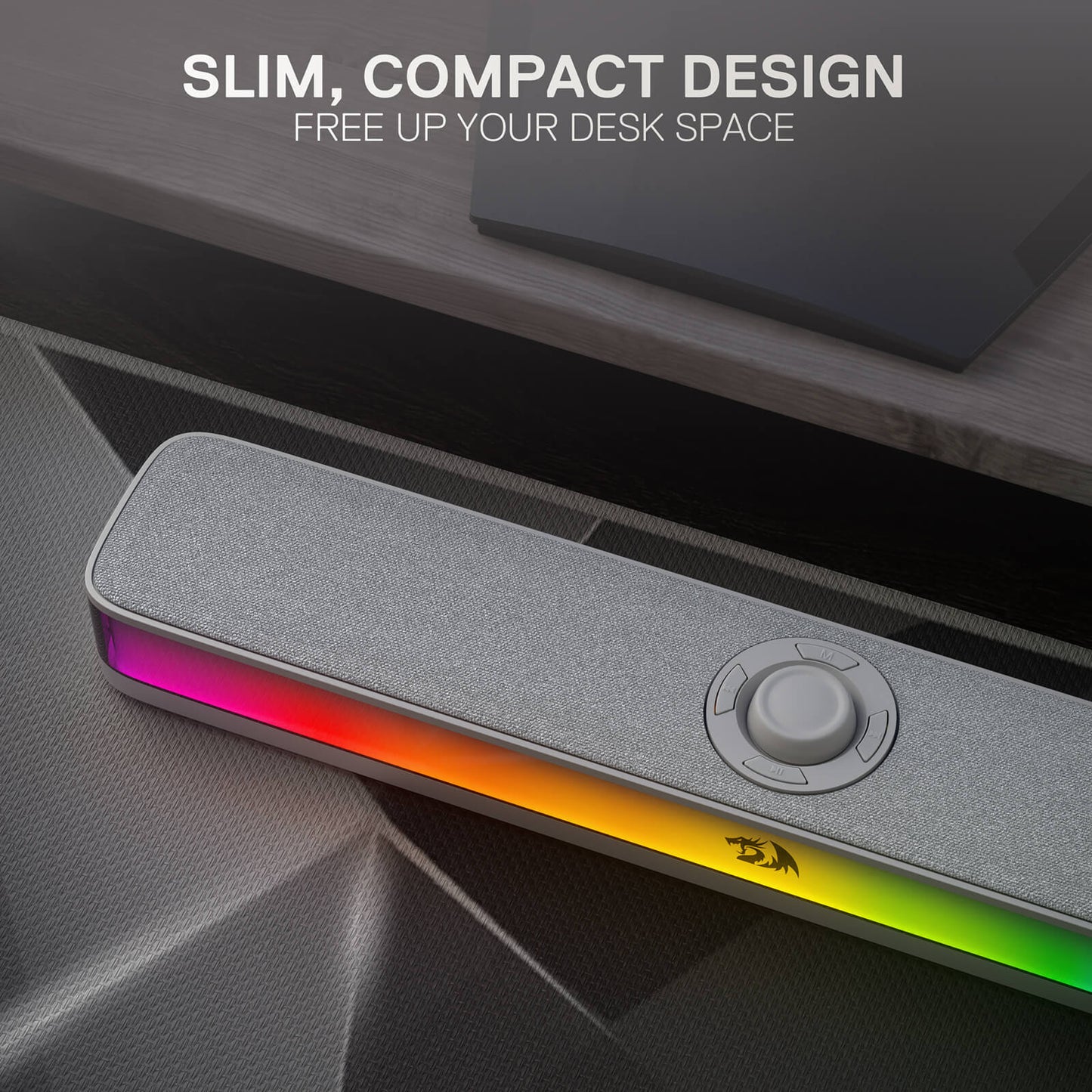Gaming desk with a slim, compact RGB light strip on a dark surface