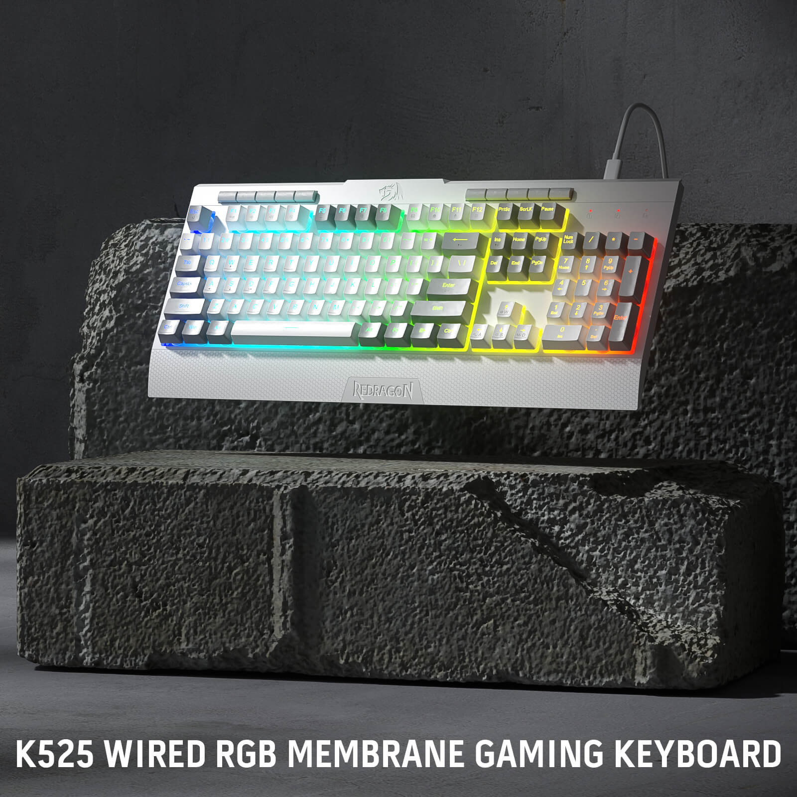 Redragon White K525 Wired RGB Membrane Gaming Keyboard on a dark stone surface with a dark background