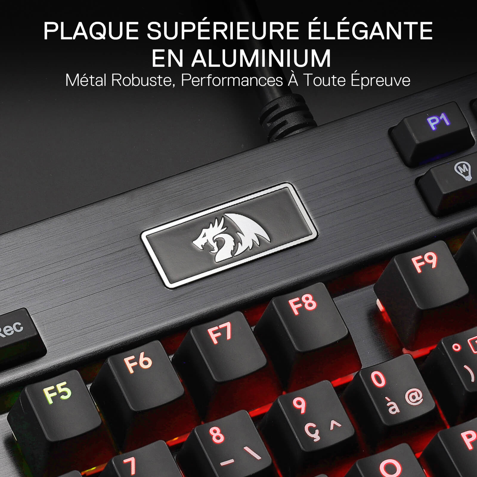Gaming keyboard with metallic plaque and dragon logo on a dark background