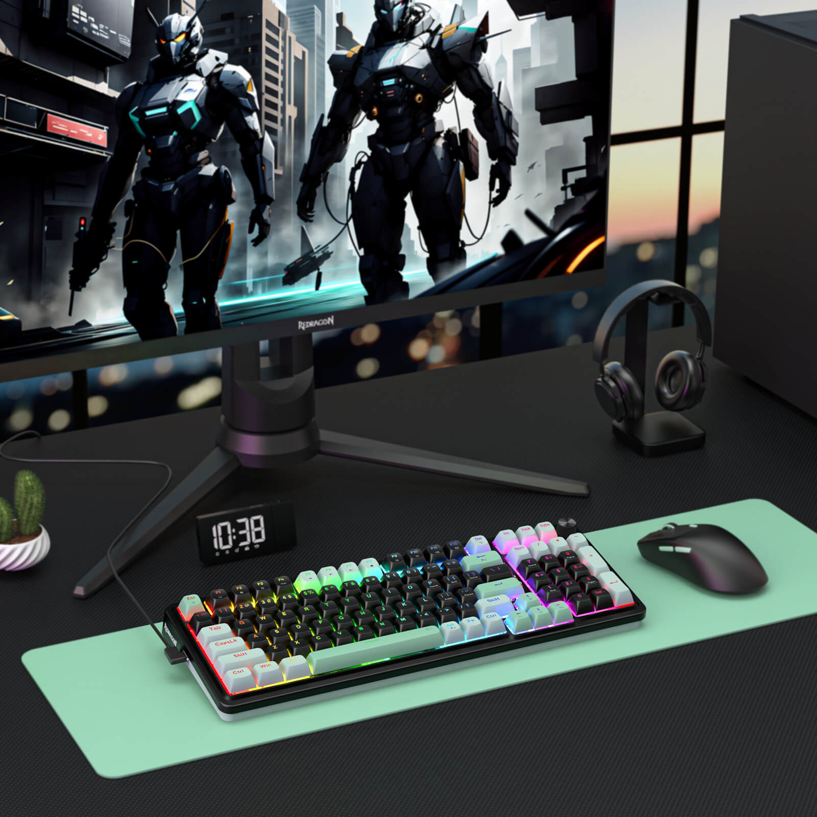 Gaming setup with monitor, keyboard, mouse, and headset on a desk.
