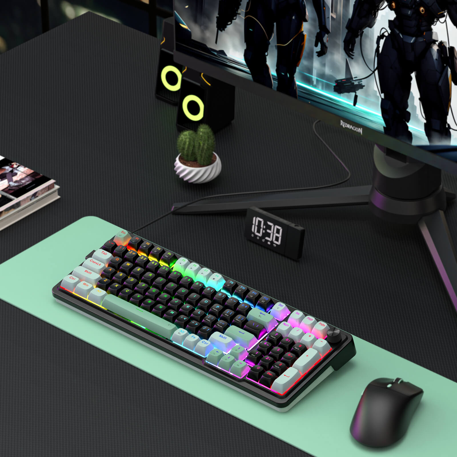 Gaming desk setup with a keyboard, mouse, and monitor on a green mouse pad.