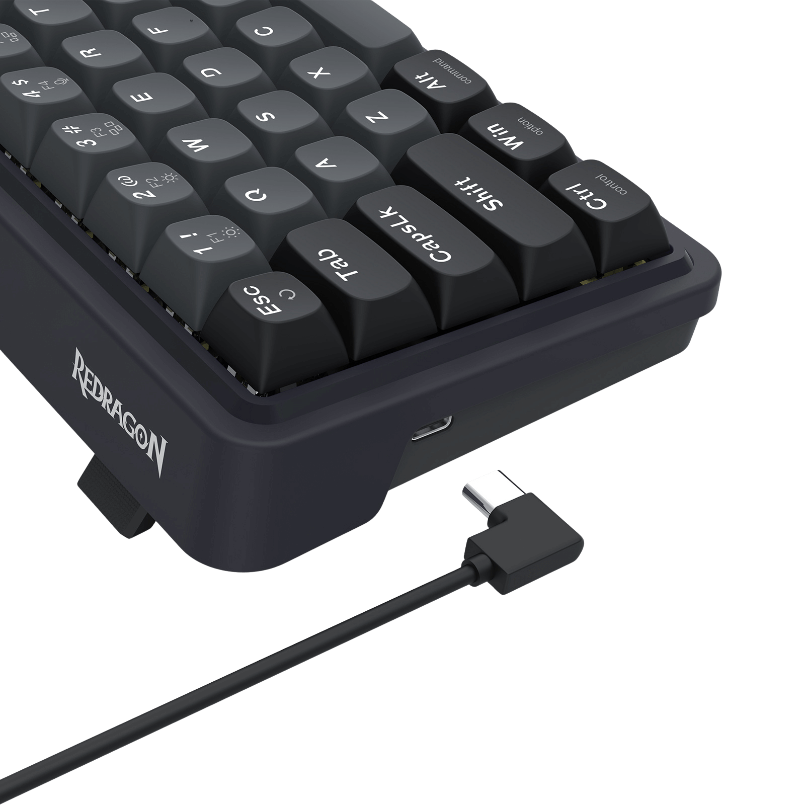 Black keyboard with USB cable on a black background, featuring the Redragon brand.