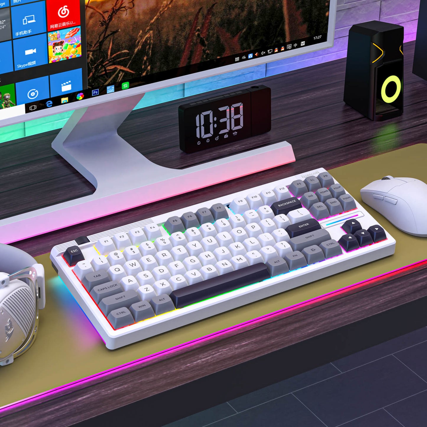 Computer setup with keyboard, mouse, monitor, and clock on a desk
