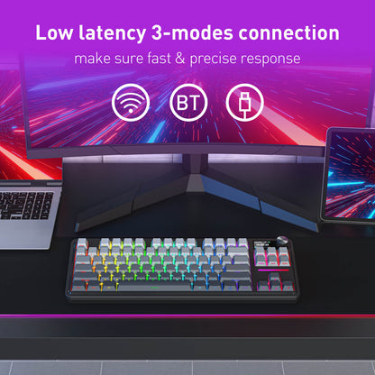 Gaming setup with monitor, keyboard, and laptop on a desk, featuring text about low latency connection modes.