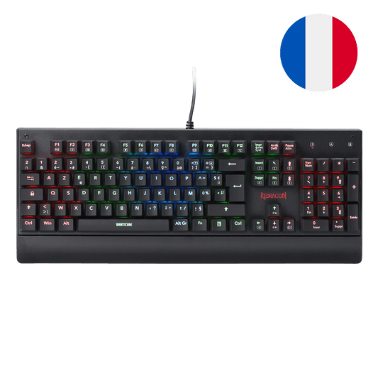 Le clavier mécanique Redragon Manticore est affiché avec son éclairage RGB multicolore, un repose-poignet intégré et un interrupteur bleu détachable pour démontrer son design modulaire.