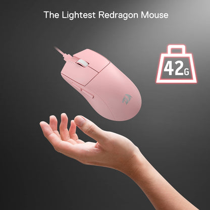 A hand holding up the ultra-light 42g Redragon M996 pink mouse.