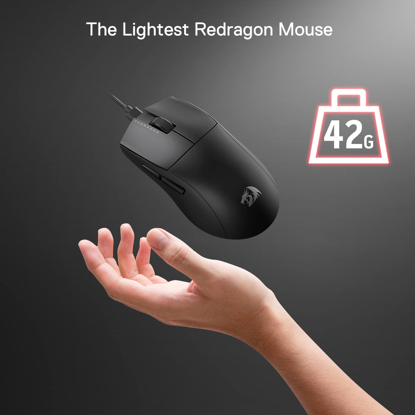 A hand holding up the ultra-light 42g Redragon M996 black mouse.