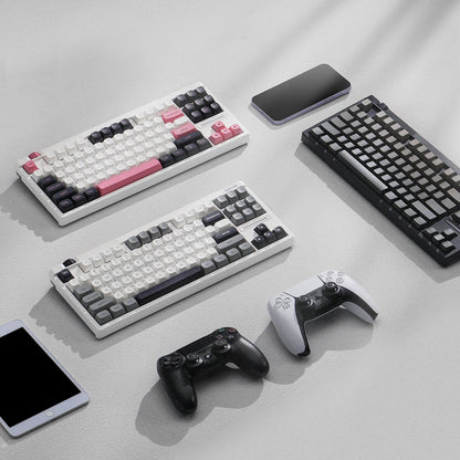 Collection of Redragon K729 series mechanical keyboards and gaming controllers on a light gray surface