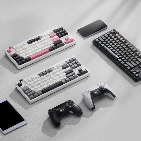 Collection of Redragon K729 series mechanical keyboards and gaming controllers on a light gray surface