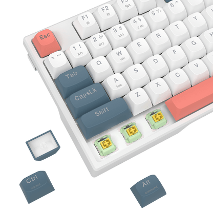White mechanical keyboard keycap set with custom key labels, showing detached keys and three exposed switches on a black background.