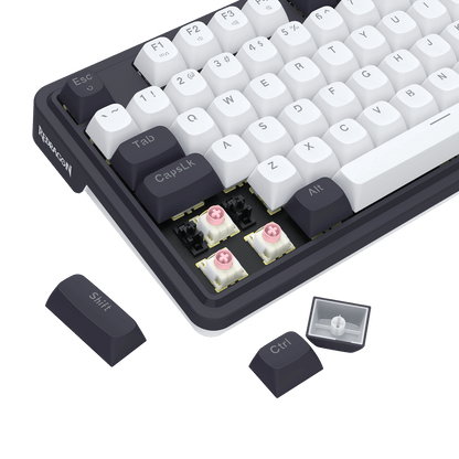 Mechanical keyboard with white keys and black frame on a black background