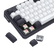Mechanical keyboard with white keys and black frame on a black background