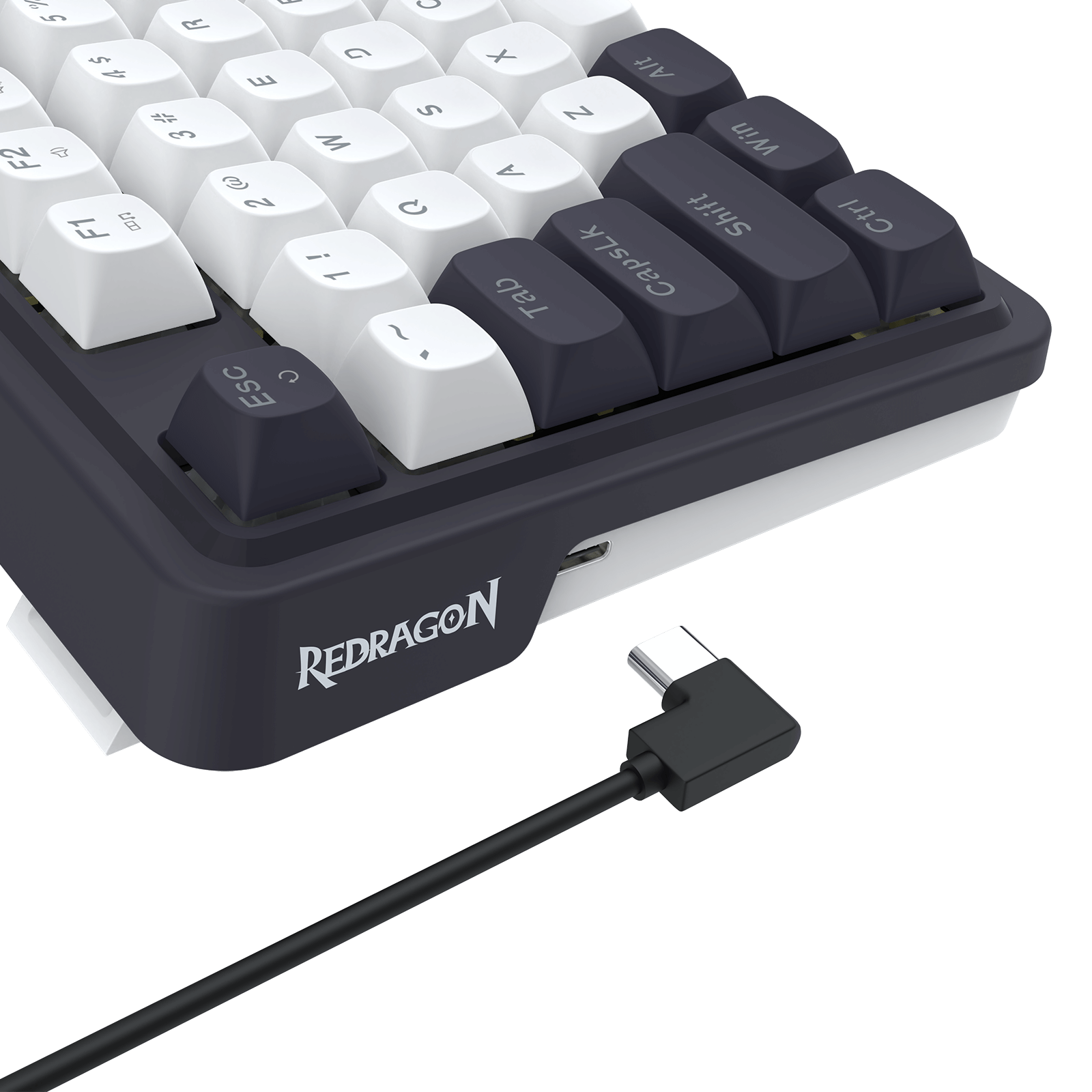 Redragon keyboard with USB cable on a black background