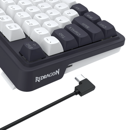Redragon keyboard with USB cable on a black background