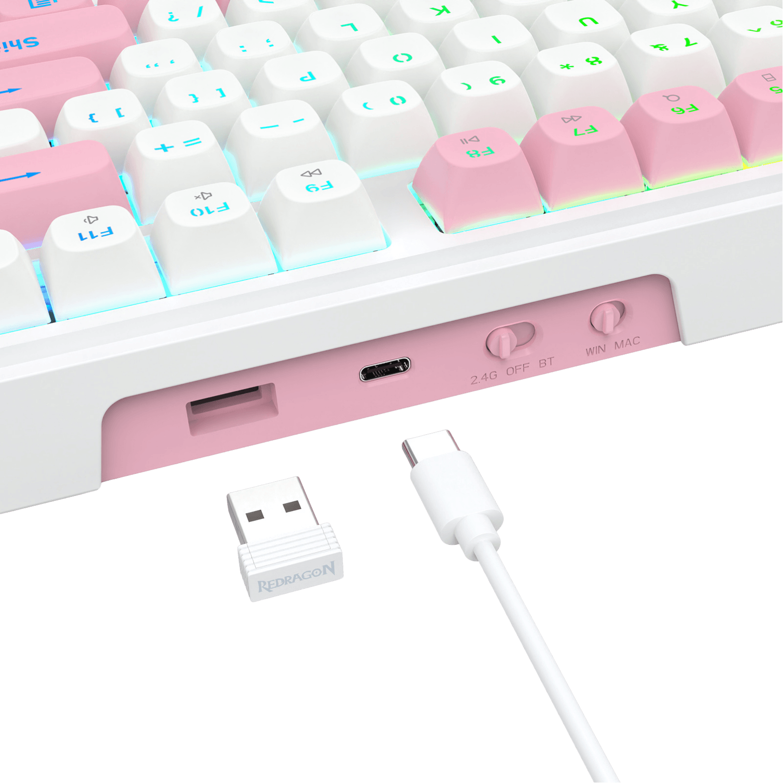 Close-up of a white and pastel pink mechanical keyboard showing the port area, with a small white USB receiver and white cable in front on a clean white background.