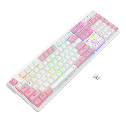 A compact mechanical keyboard with a white frame and pastel pink-to-white gradient keycaps, illuminated with multicolor RGB backlighting, shown on a black background with a small USB receiver.