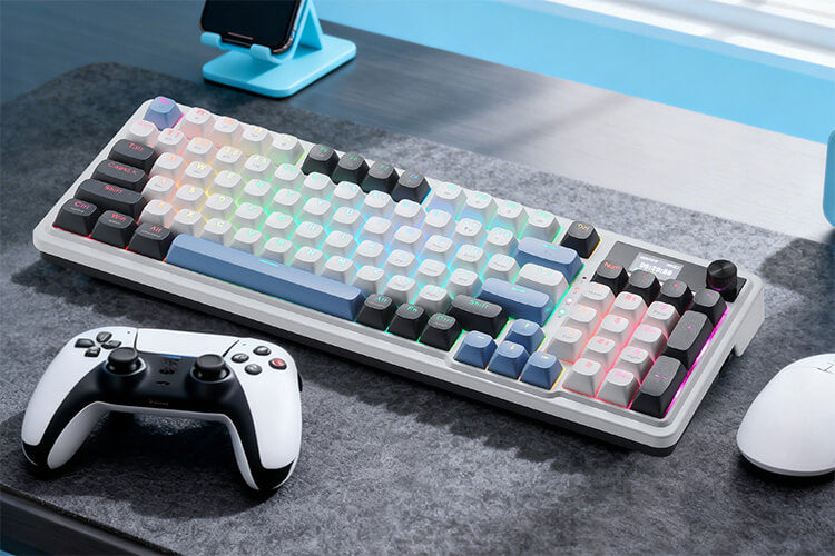 Gaming keyboard with colorful backlighting on a desk with a controller and mouse.