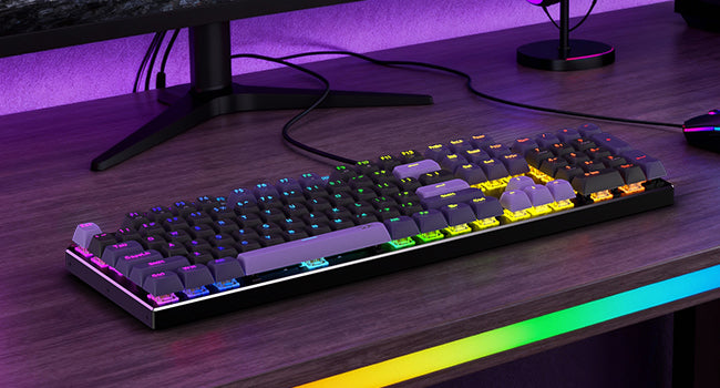 Redragon K556 HE Gaming keyboard with RGB lighting on a desk