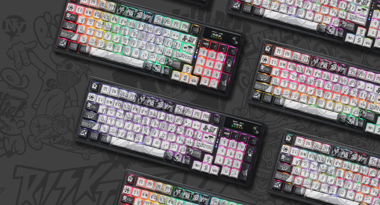 Multiple keyboards with colorful keycaps on a dark background