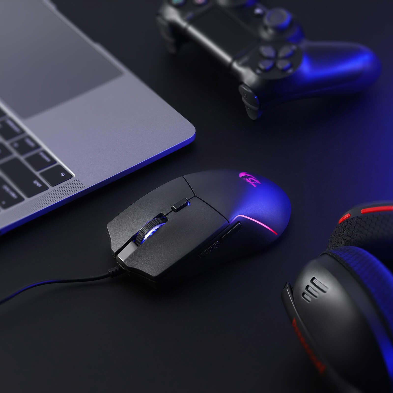A close-up of the Redragon gaming mouse (with RGB backlighting) is shown on a desk, paired with a laptop, controller, and headset to highlight its fit in a gaming setup.