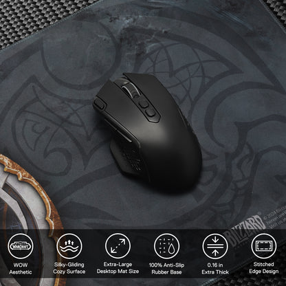 A black gaming mouse rests on the WoW mouse pad, with icons listing its features: WoW-themed design, silky surface, extra-large size, anti-slip base, 0.16" thickness, and stitched edges.