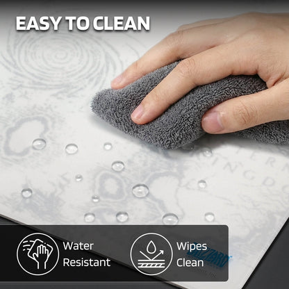 The mouse pad is "EASY TO CLEAN" (water-resistant, wipeable), shown with a hand cleaning water droplets off its surface.