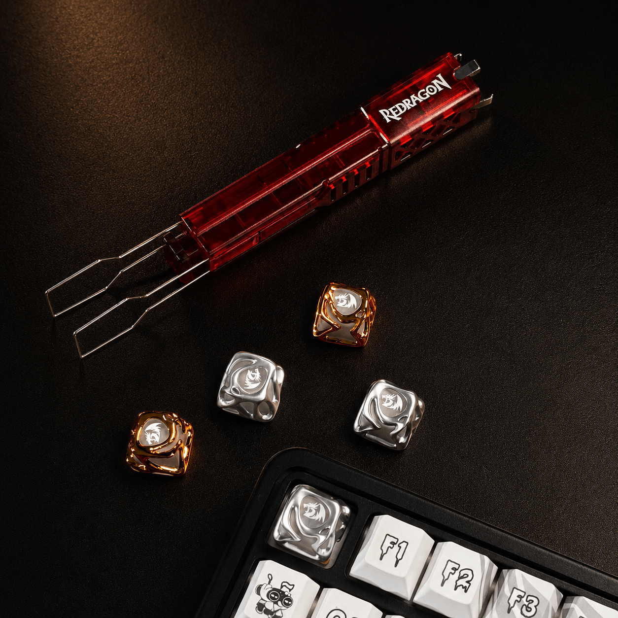 Redragon tool set with keyboard keycaps on a dark surface